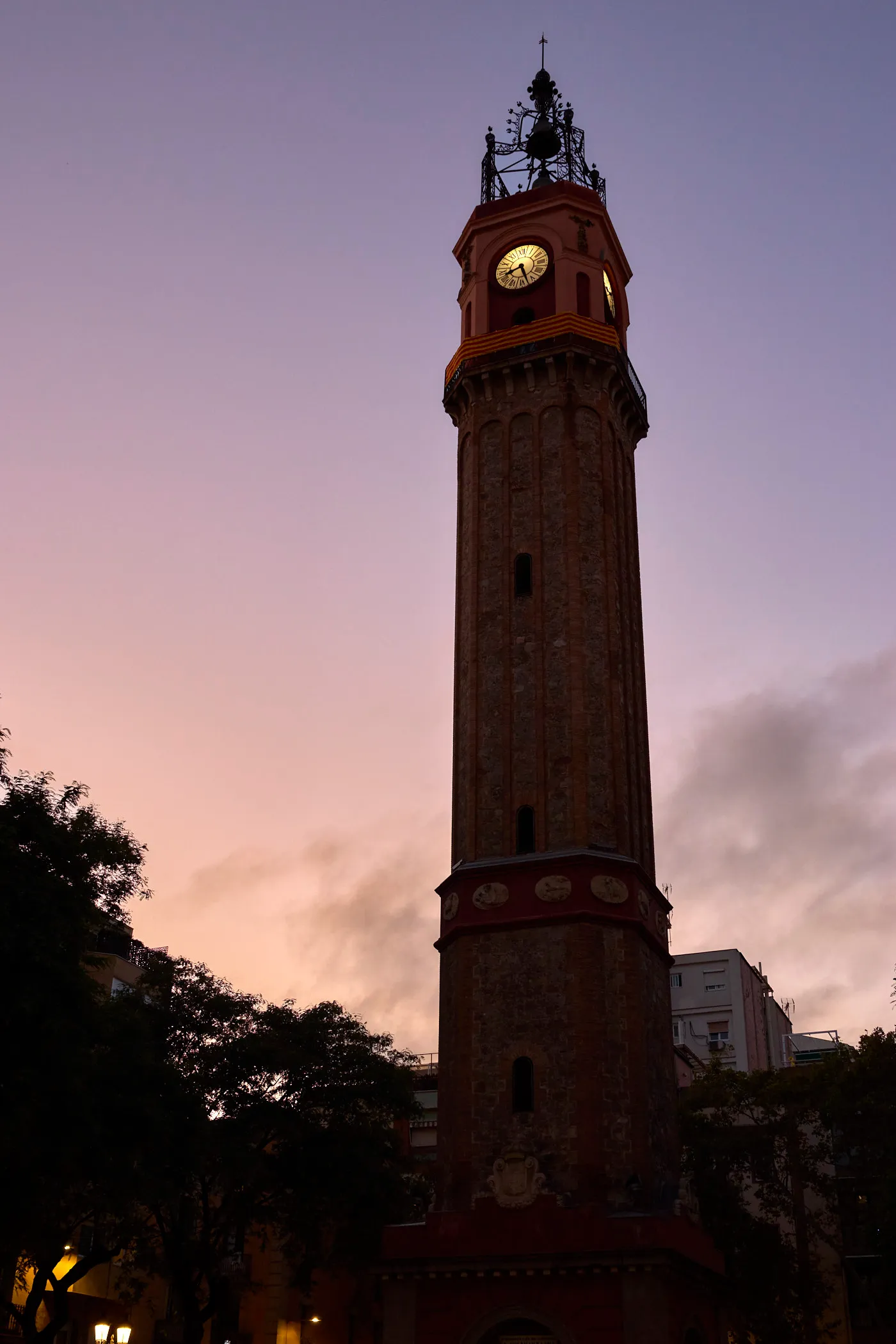 Gracia clock tower dusk barcelona