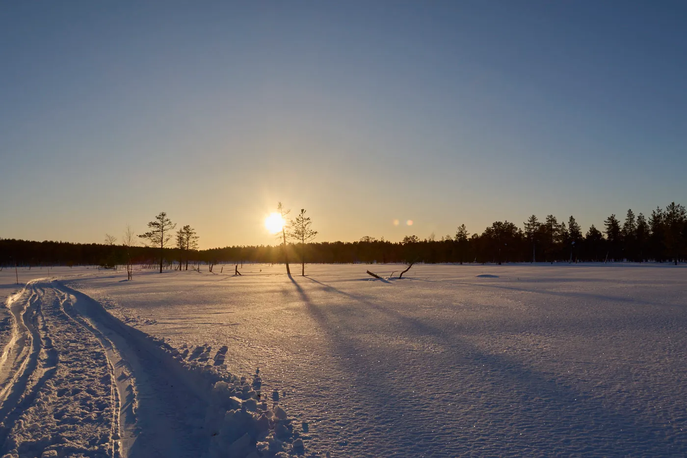 Snow trail sunset lapland